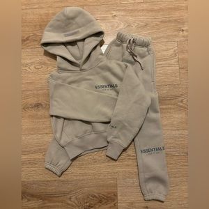 Kid’s Fear of God Essentials sweat suit in light brown